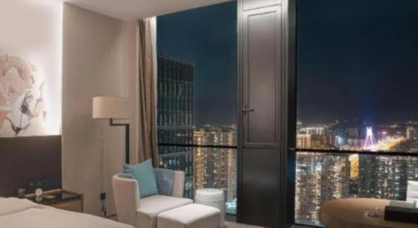 Bed in LONGYAN JINGHUA FLIPORT HOTEL