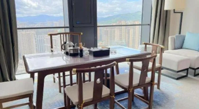 Bed in LONGYAN JINGHUA FLIPORT HOTEL