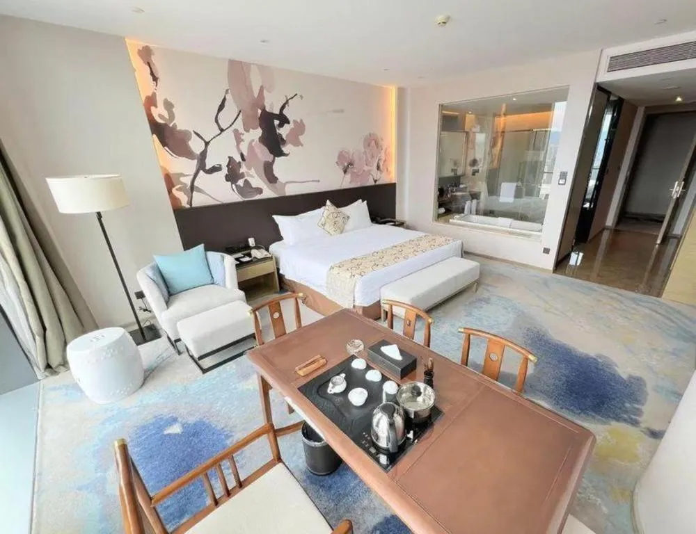 Bed in LONGYAN JINGHUA FLIPORT HOTEL