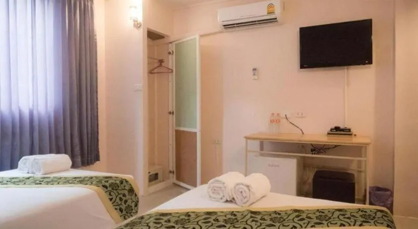 Bed in BIRD ROOM HOTEL - PRATUNAM