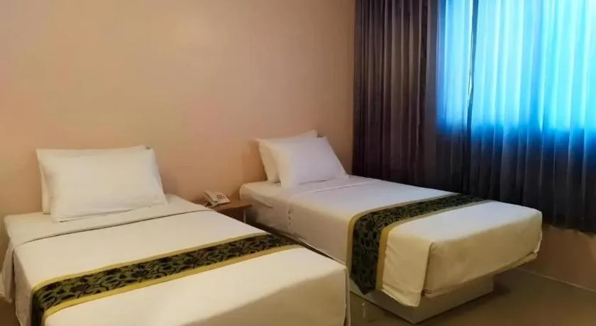 Bed in BIRD ROOM HOTEL - PRATUNAM