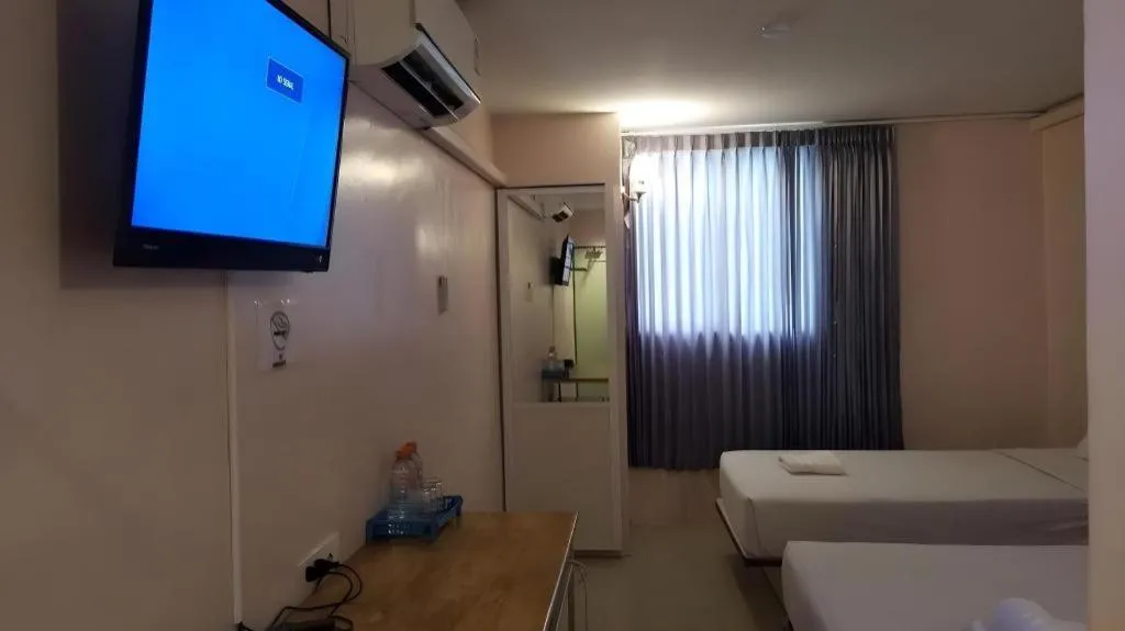 Bed in BIRD ROOM HOTEL - PRATUNAM