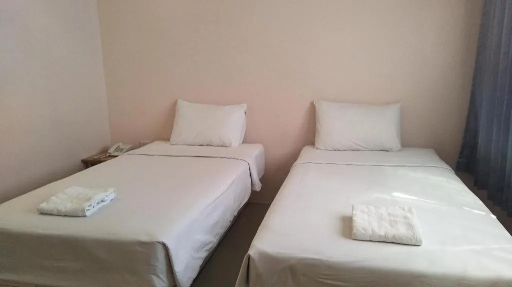 Bed in BIRD ROOM HOTEL - PRATUNAM