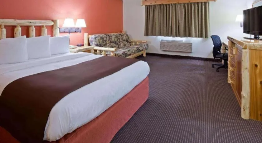 Bed in AmericInn by Wyndham Pequot Lakes