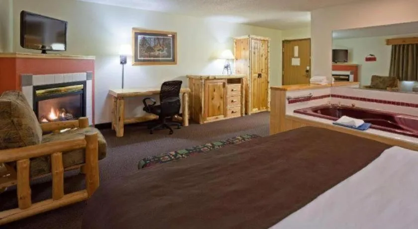 Bed in AmericInn by Wyndham Pequot Lakes