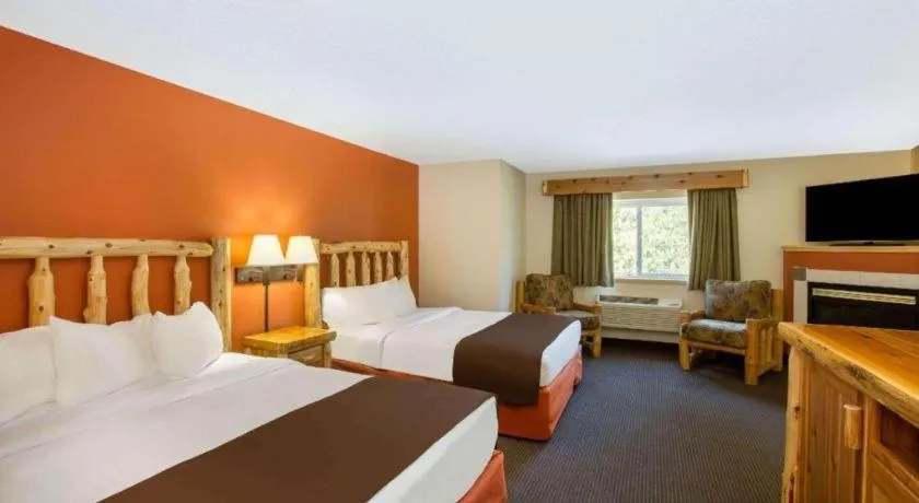 Bed in AmericInn by Wyndham Pequot Lakes