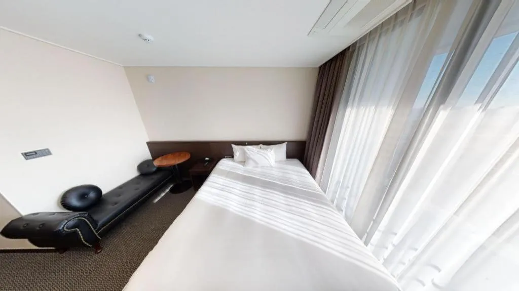Bed in Riviera Incheon Airport Hotel