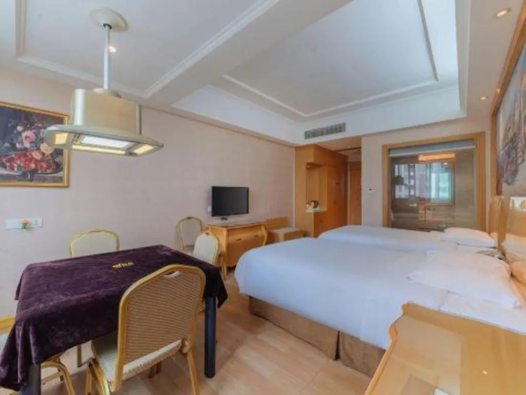 Bed in Vienna Hotel Guangdong Qingyuan Wanda Plaza Xincheng Beijiang