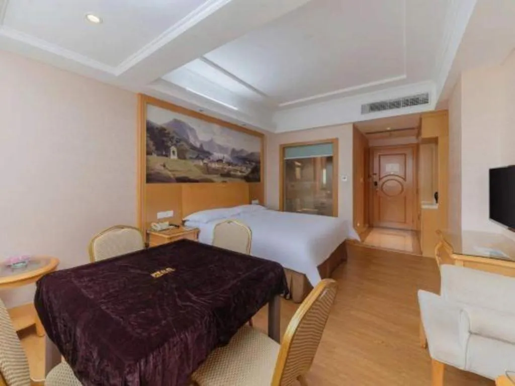 Bed in Vienna Hotel Guangdong Qingyuan Wanda Plaza Xincheng Beijiang