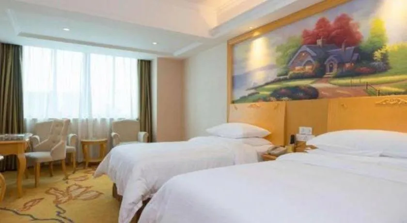 Bed in Vienna Hotel Guangdong Qingyuan Wanda Plaza Xincheng Beijiang