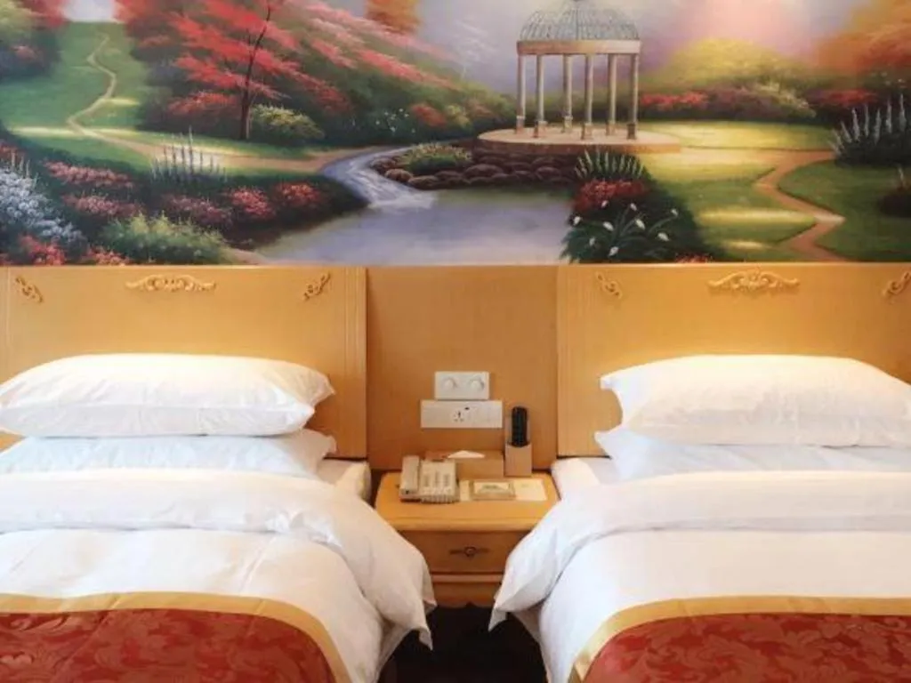 Bed in Vienna Hotel Guangdong Qingyuan Wanda Plaza Xincheng Beijiang