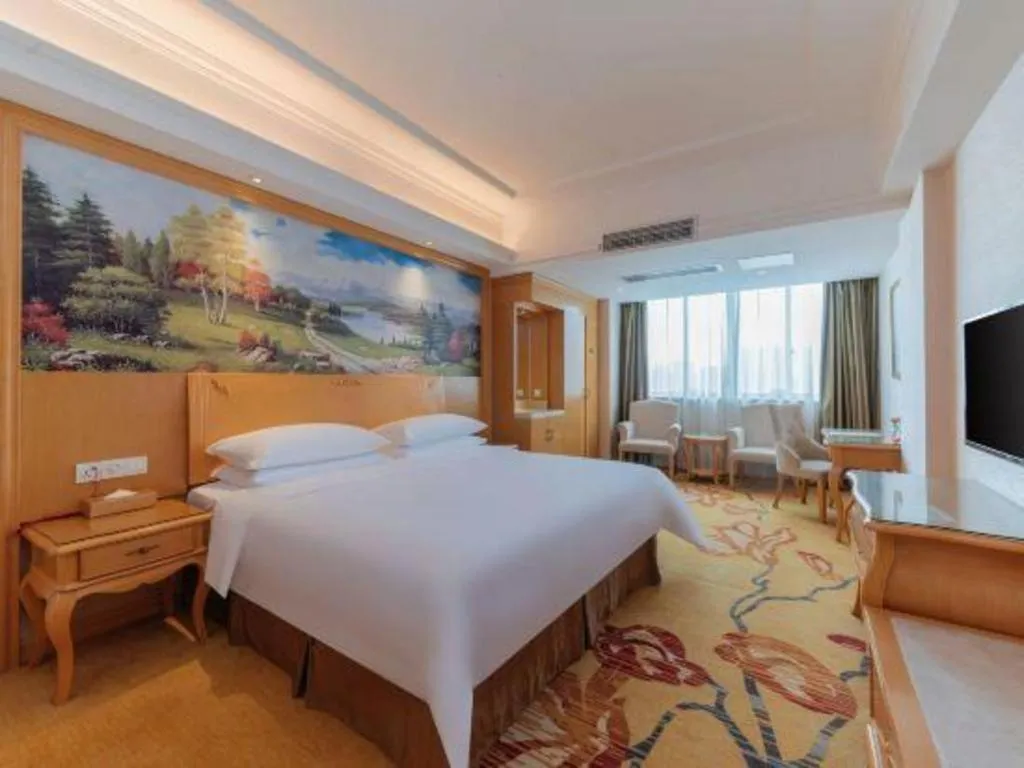 Bed in Vienna Hotel Guangdong Qingyuan Wanda Plaza Xincheng Beijiang