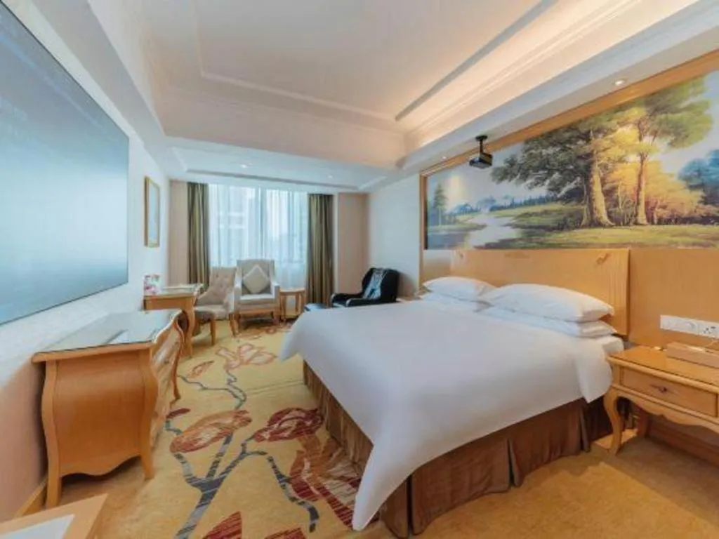 Bed in Vienna Hotel Guangdong Qingyuan Wanda Plaza Xincheng Beijiang