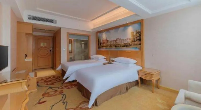 Bed in Vienna Hotel Guangdong Qingyuan Wanda Plaza Xincheng Beijiang