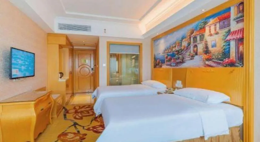 Bed in Vienna Hotel Guangdong Qingyuan Wanda Plaza Xincheng Beijiang