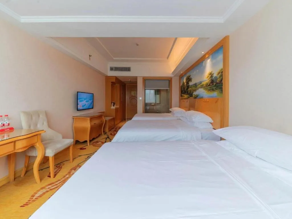 Bed in Vienna Hotel Guangdong Qingyuan Wanda Plaza Xincheng Beijiang