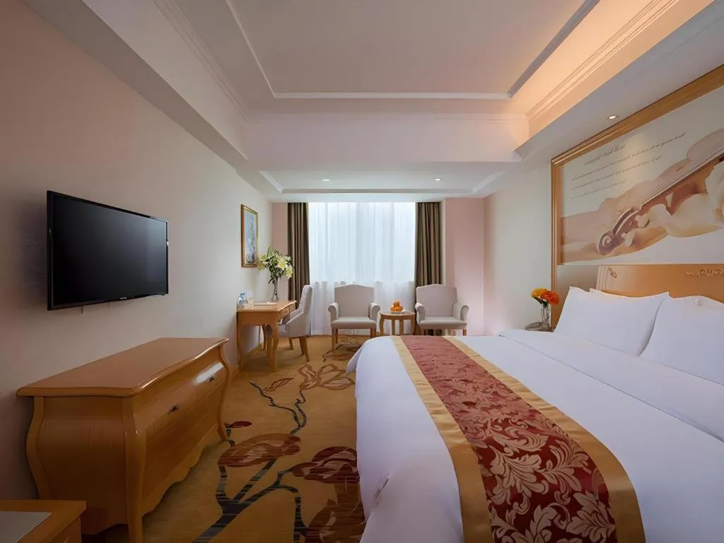 Bed in Vienna Hotel Guangdong Qingyuan Wanda Plaza Xincheng Beijiang