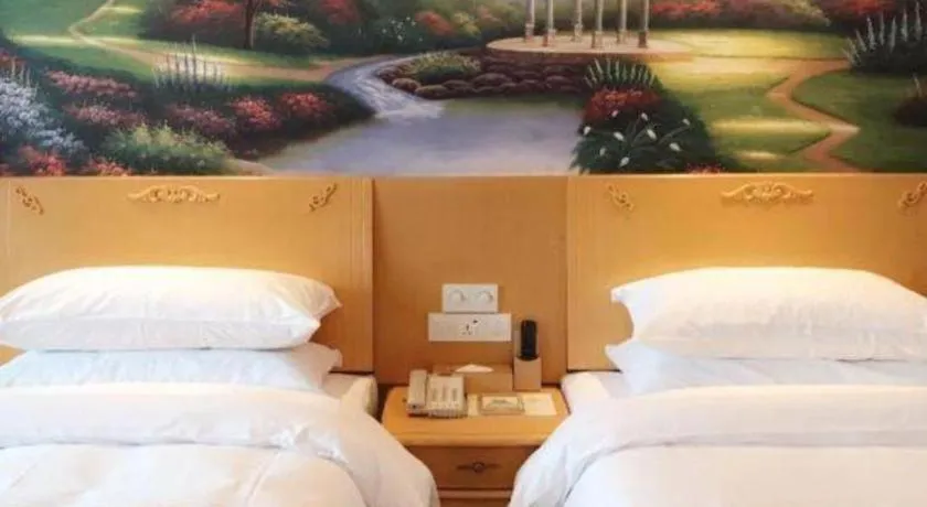 Bed in Vienna Hotel Guangdong Qingyuan Wanda Plaza Xincheng Beijiang