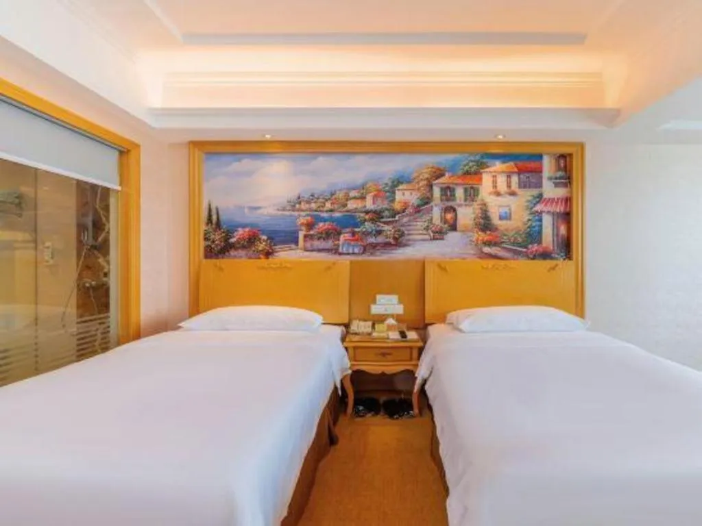 Bed in Vienna Hotel Guangdong Qingyuan Wanda Plaza Xincheng Beijiang