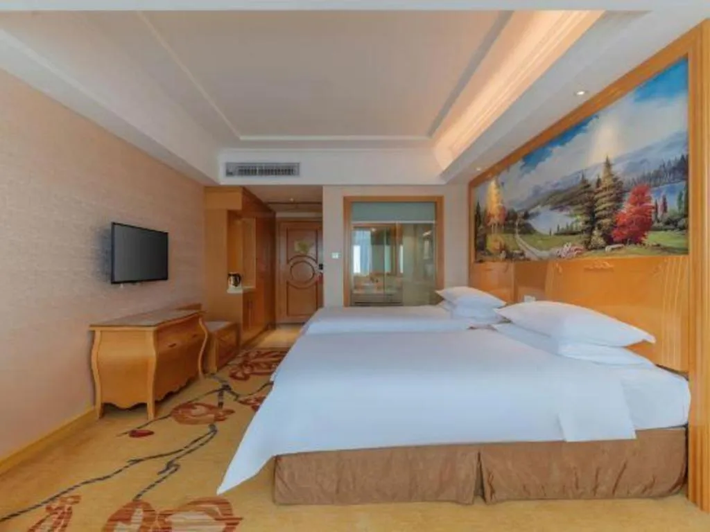 Bed in Vienna Hotel Guangdong Qingyuan Wanda Plaza Xincheng Beijiang