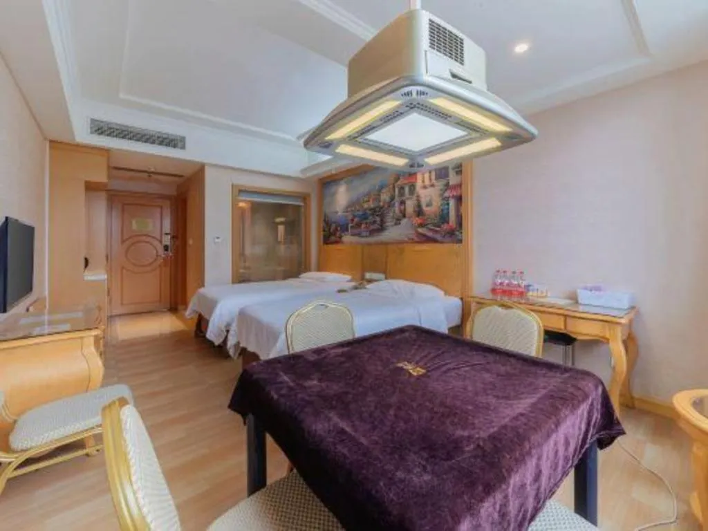 Bed in Vienna Hotel Guangdong Qingyuan Wanda Plaza Xincheng Beijiang