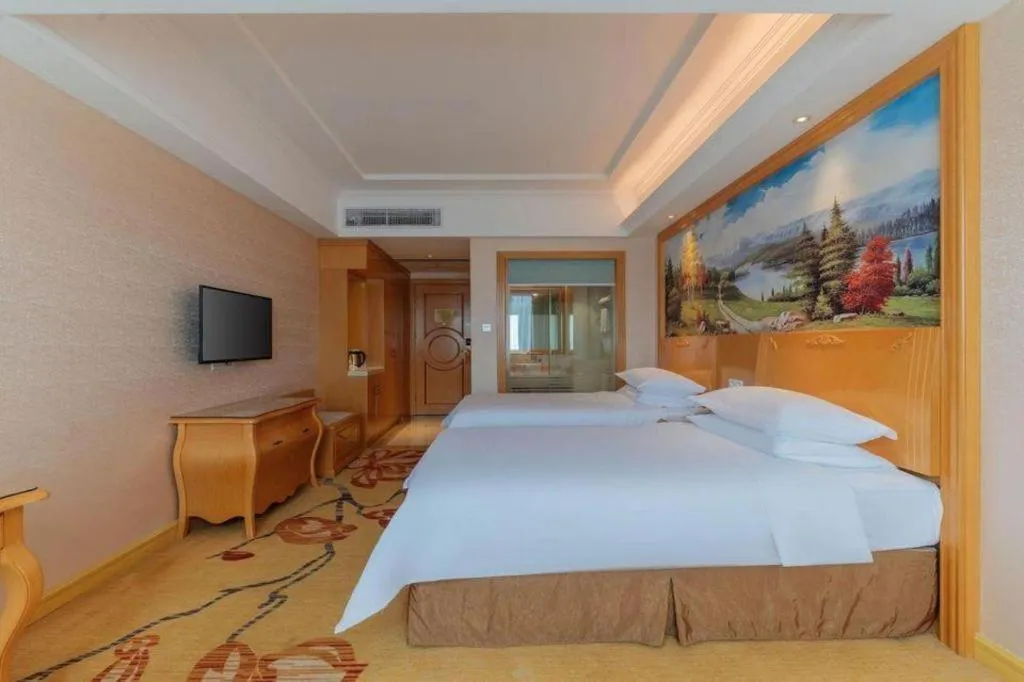 Bed in Vienna Hotel Guangdong Qingyuan Wanda Plaza Xincheng Beijiang
