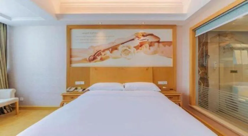 Bed in Vienna Hotel Guangdong Qingyuan Wanda Plaza Xincheng Beijiang