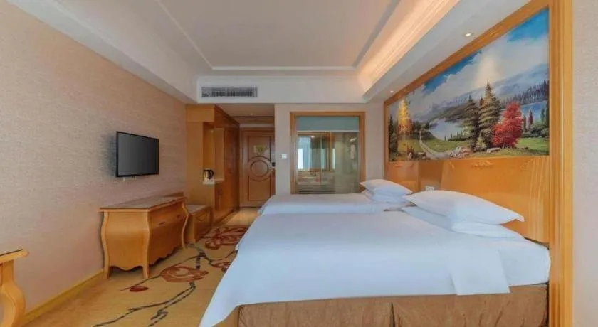 Bed in Vienna Hotel Guangdong Qingyuan Wanda Plaza Xincheng Beijiang