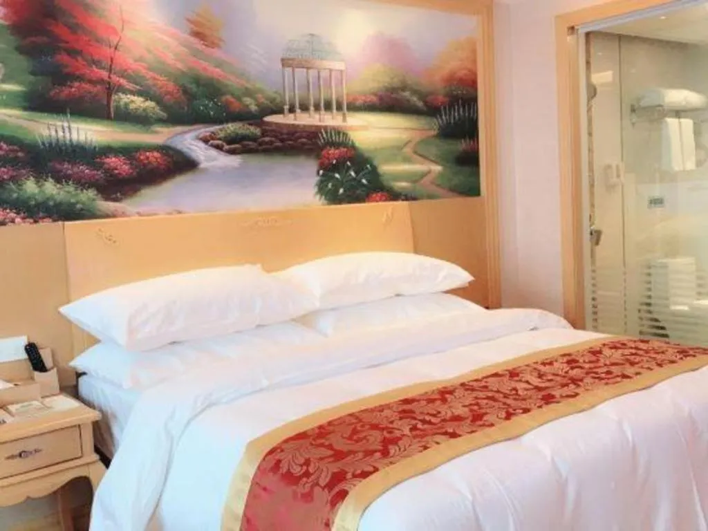 Bed in Vienna Hotel Guangdong Qingyuan Wanda Plaza Xincheng Beijiang