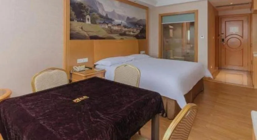 Bed in Vienna Hotel Guangdong Qingyuan Wanda Plaza Xincheng Beijiang