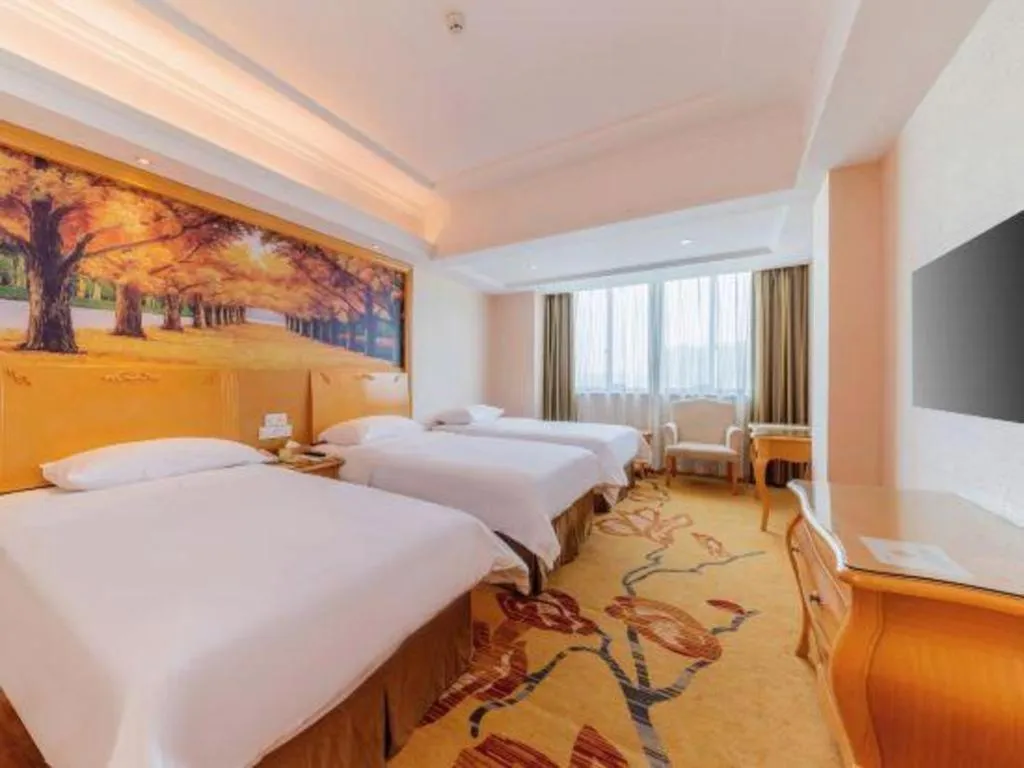 Bed in Vienna Hotel Guangdong Qingyuan Wanda Plaza Xincheng Beijiang