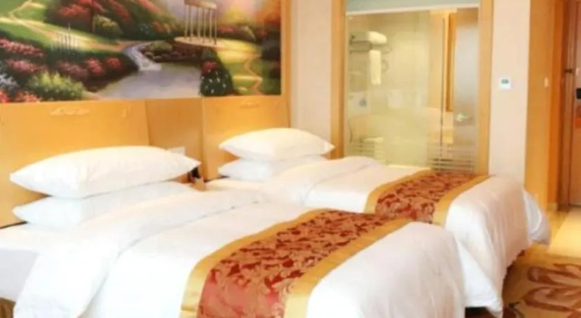 Bed in Vienna Hotel Guangdong Qingyuan Wanda Plaza Xincheng Beijiang