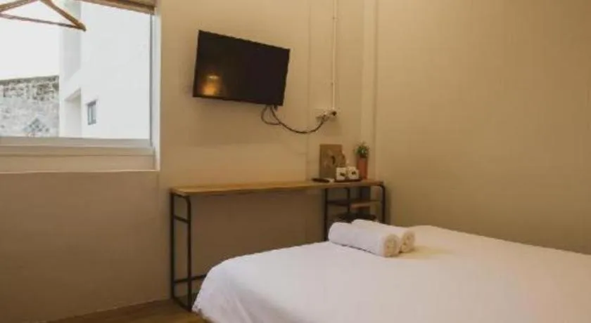 Bed in Sirichai Design Hotel