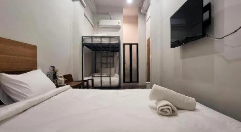 Bed in Sirichai Design Hotel
