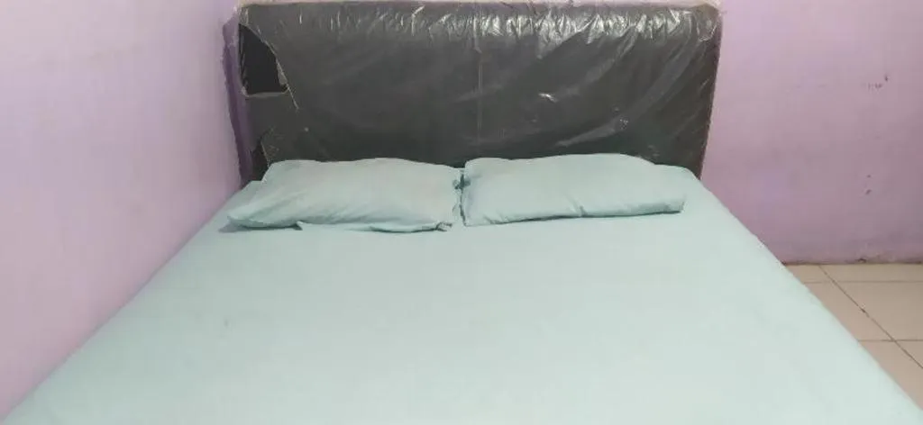 Bed in Hotel O Papi Inn Guesthouse