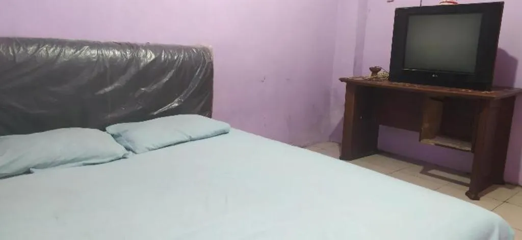 Bed in Hotel O Papi Inn Guesthouse