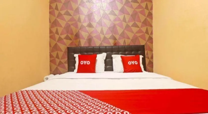 Bed in Hotel O Papi Inn Guesthouse