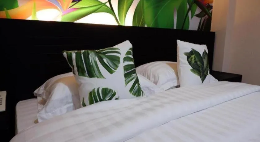 Bed in Tropical Point Hotel Syariah