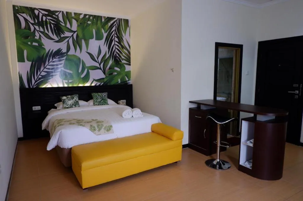 Bed in Tropical Point Hotel Syariah