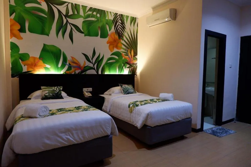 Bed in Tropical Point Hotel Syariah