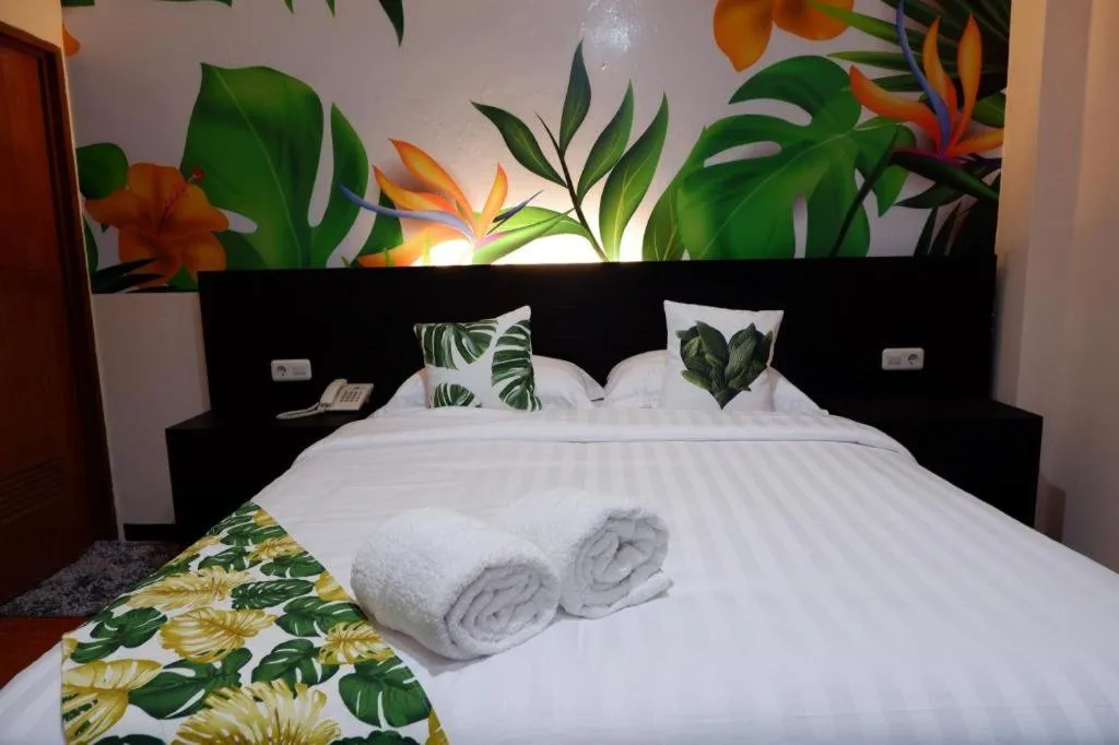 Bed in Tropical Point Hotel Syariah