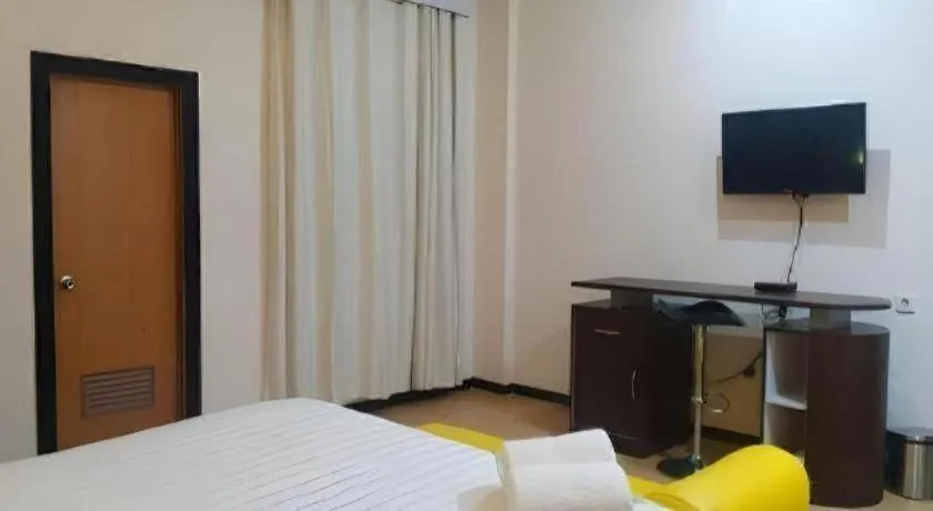 Bed in Tropical Point Hotel Syariah