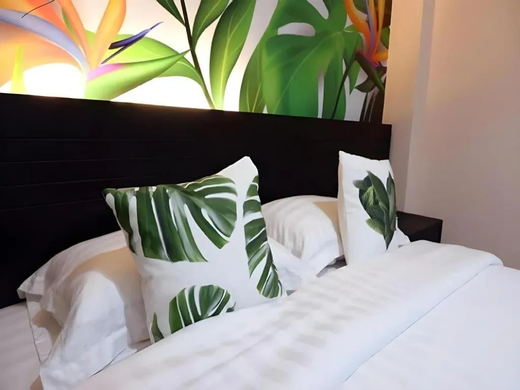 Bed in Tropical Point Hotel Syariah
