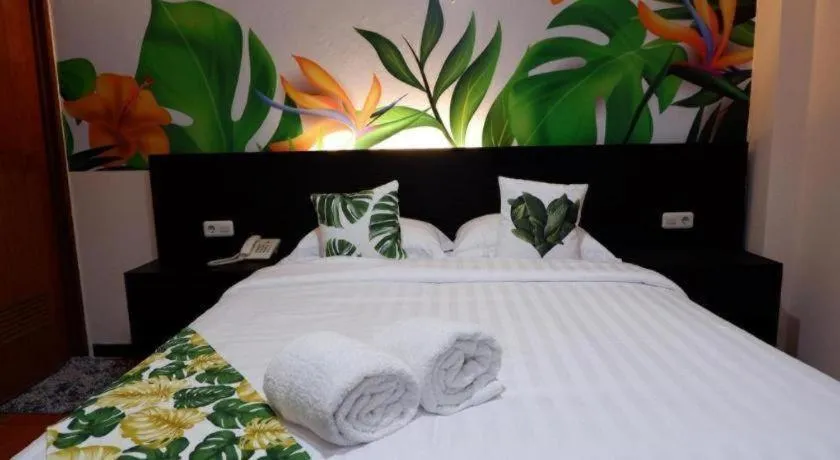 Bed in Tropical Point Hotel Syariah