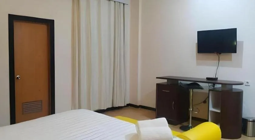 Bed in Tropical Point Hotel Syariah