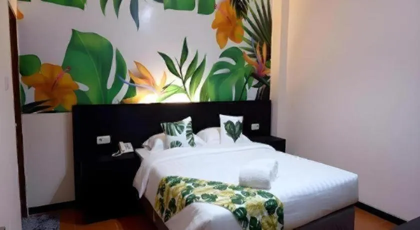 Bed in Tropical Point Hotel Syariah