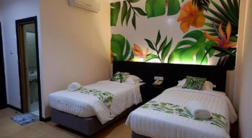 Bed in Tropical Point Hotel Syariah