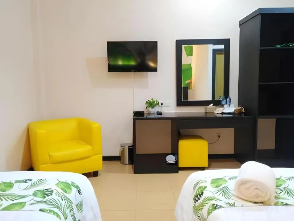 Bed in Tropical Point Hotel Syariah