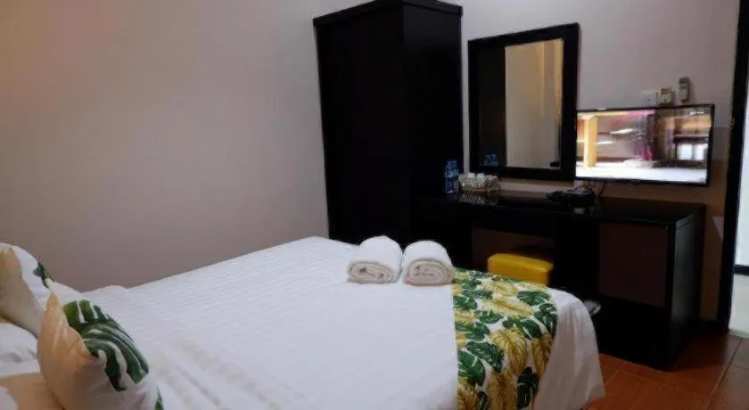 Bed in Tropical Point Hotel Syariah