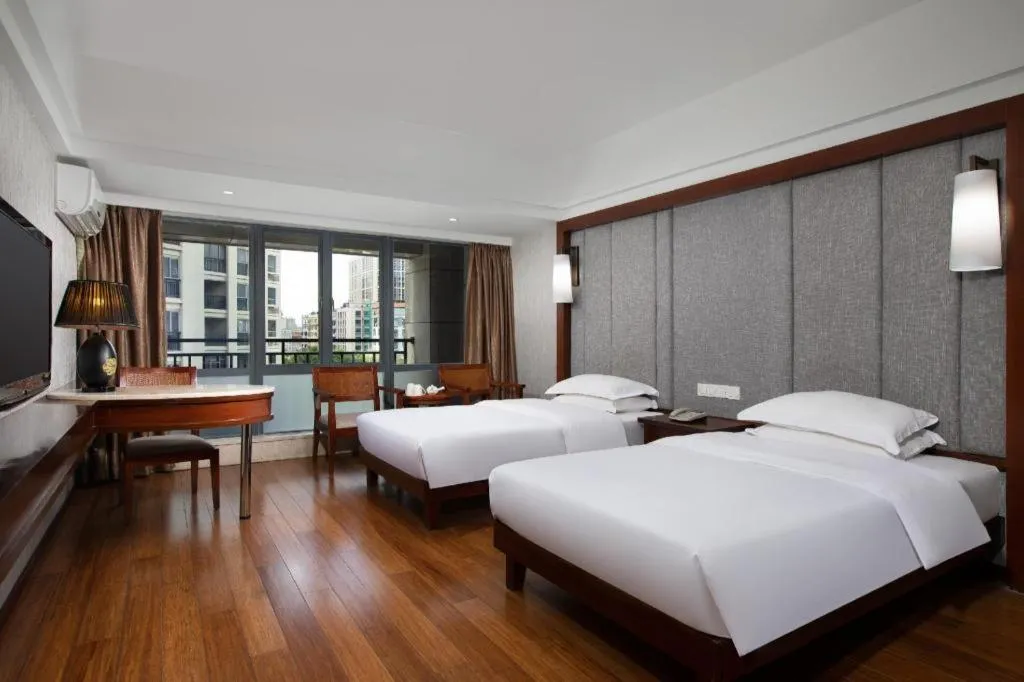 Bed in Ramada Encore by Wyndham Qionghai Downtown
